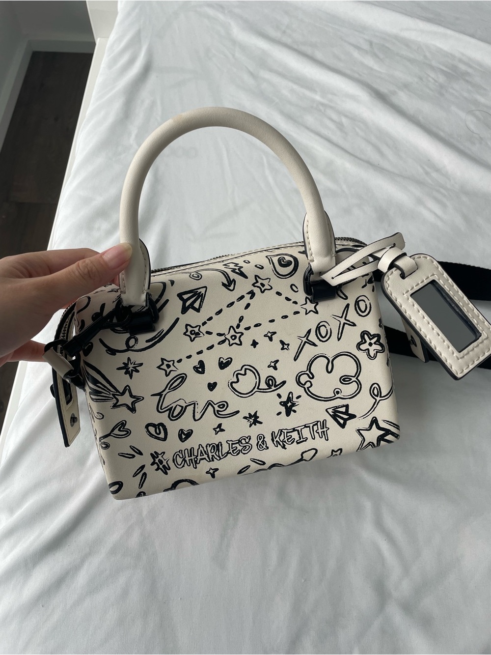 Charles & Keith Cream Top Handle Mini Bag with Black Doodle Print